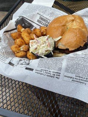 Barbecue sandwich with cheese curds and coleslaw.