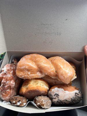 Half dozen donut box glazed twist, chocolate custard filled, apple fritter, maple bar, blueberry donut holes, iced sprinkle