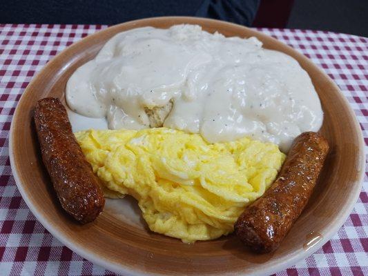 Biscuits and gravy with sausage and eggs.