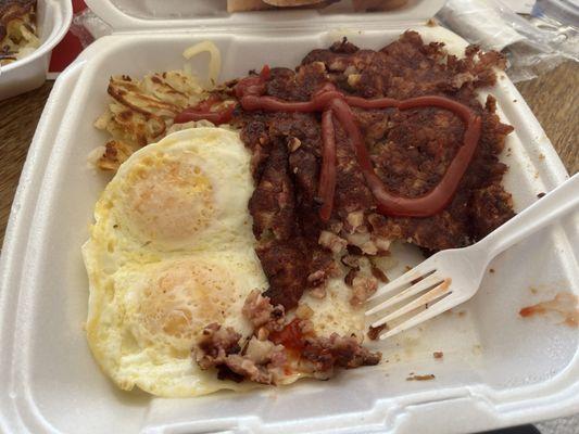 Corned beef hash with hash browns and 2 eggs