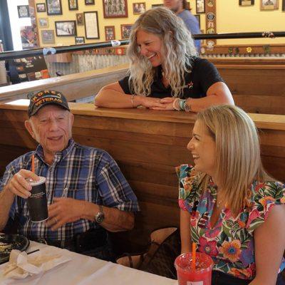 Arnold enjoying lunch with Tamara (staff) along with his children and grandchildren.