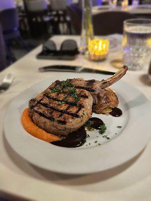 Grilled Pork Chop- gratin dauphinois, carrot citrus puree, raspberry balsamic puree