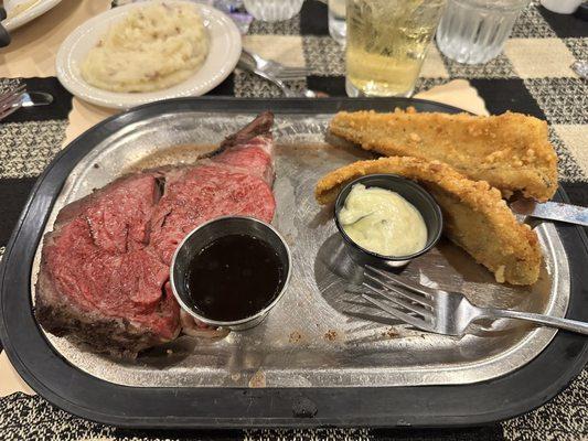 Prime rib with Parmesan encrusted walleye and garlic mashed potatoes.