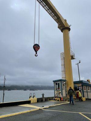 Boats are lowered in and out of the water with this crane.