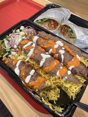 Lamb kebab over rice