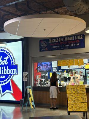 The stand with its homemade signs and a repeat customer.