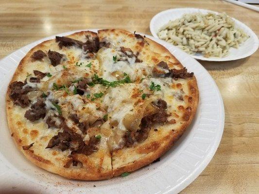 Delicious cheesesteak pita pizza