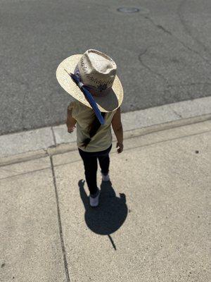 Kids sisal hat with a heart-shaped crown, custom hat band and her hand-picked feather.