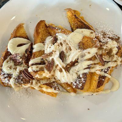 Pumpkin French Toast! Pumpkin bread base, delicious! Whip cream and pecans on top.