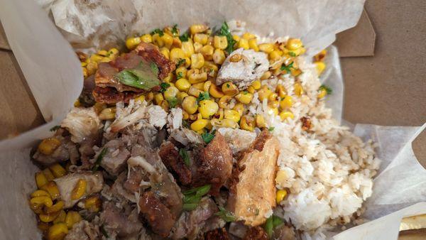 Lechon with garlic rice and corn.