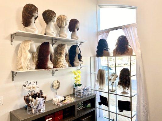 We carry human and synthetic wigs.