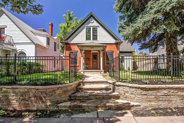 North West Denver front flagstone wall, and black metal fence