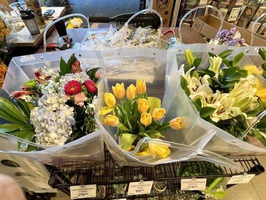 Top view of the spring flowers in bags that resemble baskets.