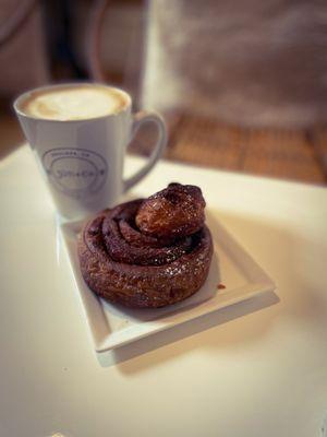 Latte and a delicious cinnamon roll