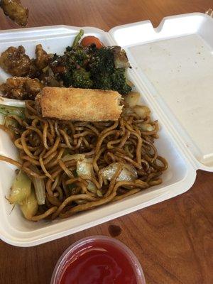 Noodles, orange chicken, broccoli and pork egg roll.