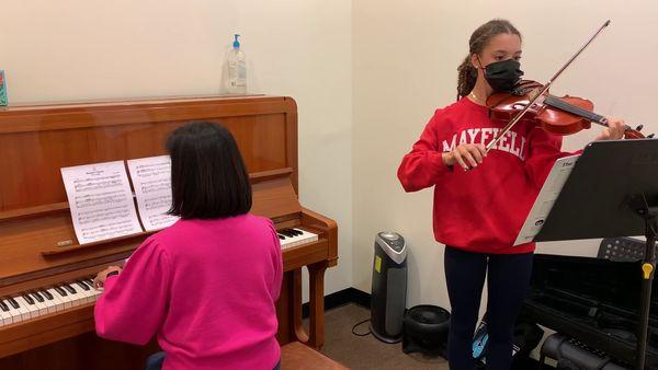 Practicing w/ piano accompaniment for the recital.