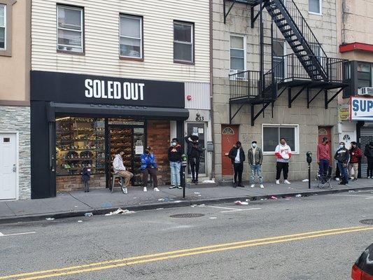 Serious line in front of this new kicks shop