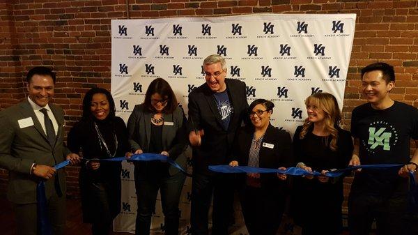 Governor Eric Holcomb cutting the tape on opening of Kenzie Academy