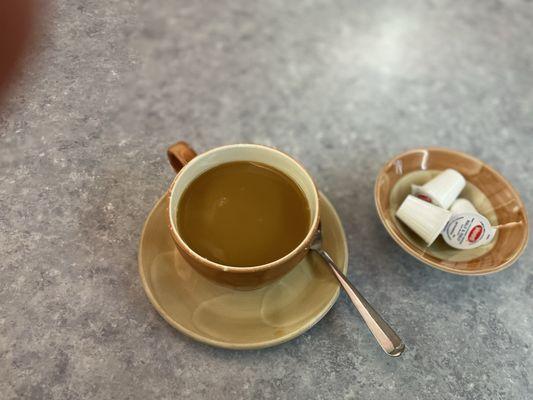 Coffee after adding raw sugar and a little 1/2-1/2 creamer