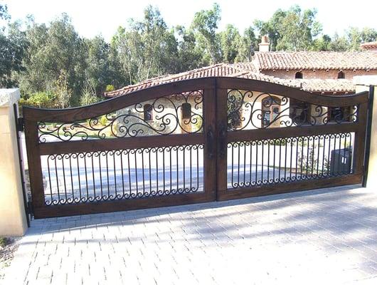 San Diego Iron Gates and Driveway Gates.
 
 This is an ornamental and wrought iron and wood gate in San Diego.