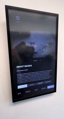 It's a touchscreen kiosk that gives customers a whole history lesson on Mazda & gives an idea of features on the vehicles.