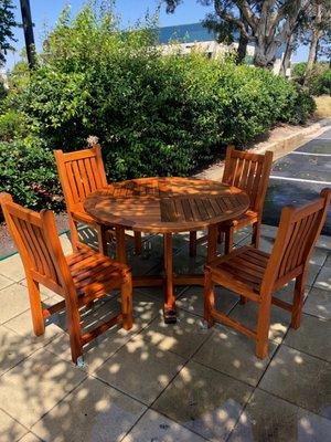 Teak table after pressure washing has been complete