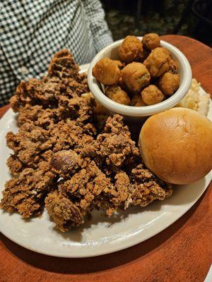 Fried chicken livers, hot roll, fried okra, and French fries.