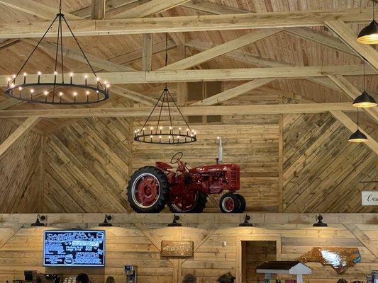 A full-size tractor in the barn