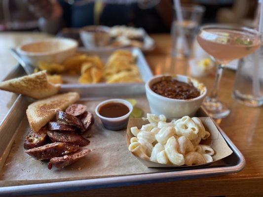 Jalapeno-Cheddar Sausage Link, House Mac, and BBQ Beans. Front Porch Cosmo Martini