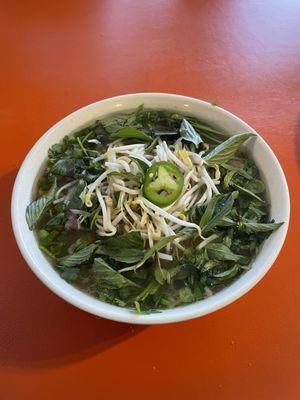 Beef pho with a TON of fresh herbs. So great to start the day off.