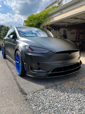 Custom mat black Tesla Model X with blue wheels