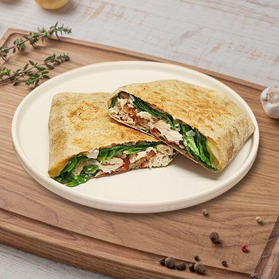 Chicken Bacon Ranch Melt - whole wheat tortilla, chicken, bacon, cheddar, spinach, tomatoes, onions, ranch