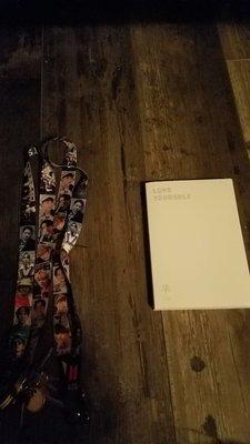 My BTS album and my 2 BTS keychains. And the lady was so nice she gave me a BTS poster.