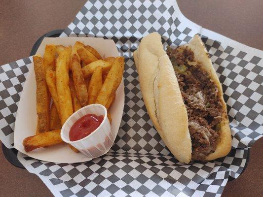 They Duke. Philly with pepper jack cheese and green chile. An order of fries. The fries are thick and nicely seasoned