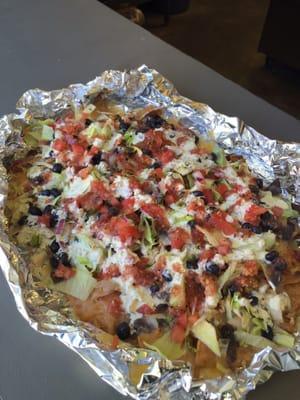 Chicken nachos with fresh made tortilla chips, jammin jalapeño sauce, house made salsa, black beans and lettuce. Incredible!