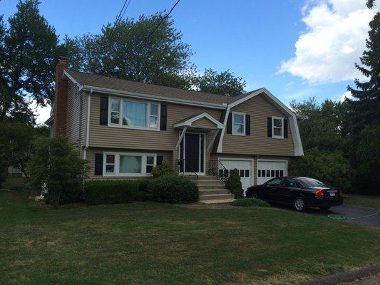 Remodeled with new vinyl siding, added front porch, and new seamless gutters