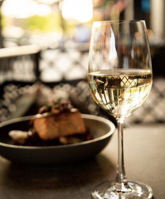 Outdoor seating, wine and salmon will make any night just right