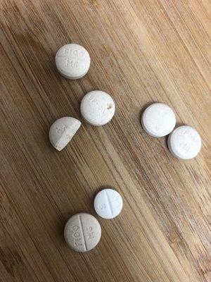 This is the pain killer pills. You can clearly see one pill is different than the others. You can also see dirt one of the pills.