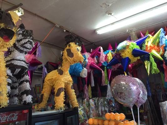 Interior filled with piñatas and party supplies