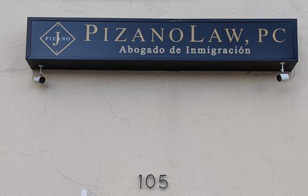 Pizano Law sign above the front door.