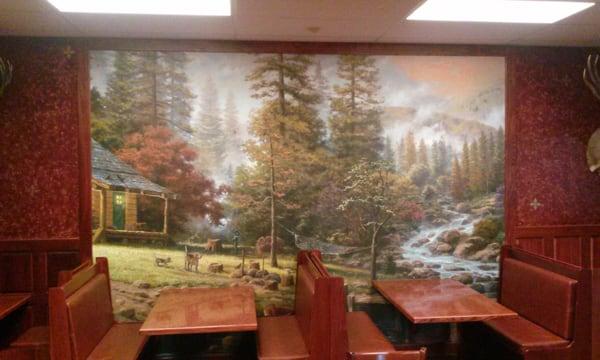 Our painted wall adds a forest like theme to your eating experience.