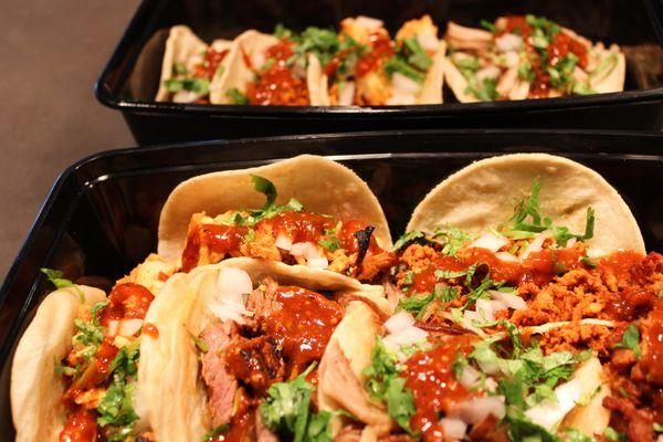 Street Tacos - Fresh mini corn or flour tortillas, topped with onion, cilantro, and salsa, filled with your choice of fillings.