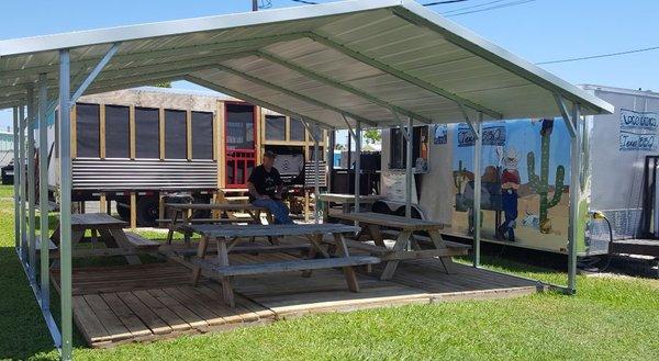 New covered seating area, along with new pit room and BBQ trailer.