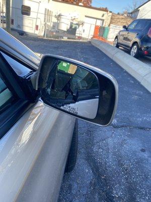 Broken passenger side mirror after going through Bee Clean Car Wash on Detroit.