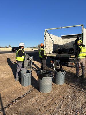 Skunky's employees loading items onto our trucks