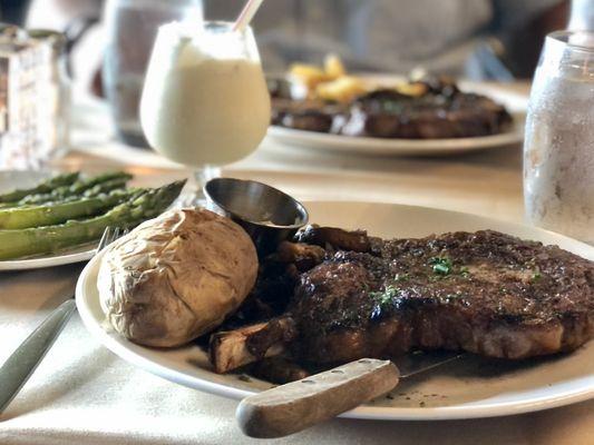 Bone-in ribeye steak, side of asparagus, brandy Alexander