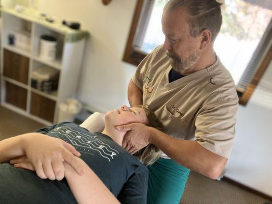 Dr Corkin providing neck (cervical spine) adjustments at Healthworks in Manasquan for Monmouth and Ocean County, New Jersey.