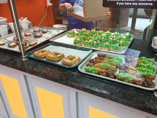 Easter themed donuts, including Easter egg donuts on the left!