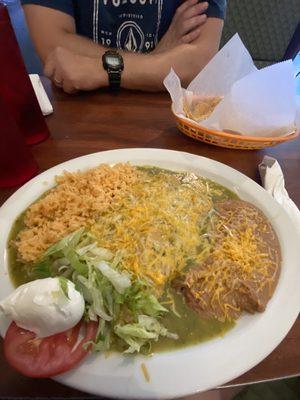 Enchiladas verdes plate with rice and beans.