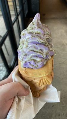 Taiyaki cone! This one has red bean filling, ube flavor soft serve, matcha powder, and condensed milk drizzle!